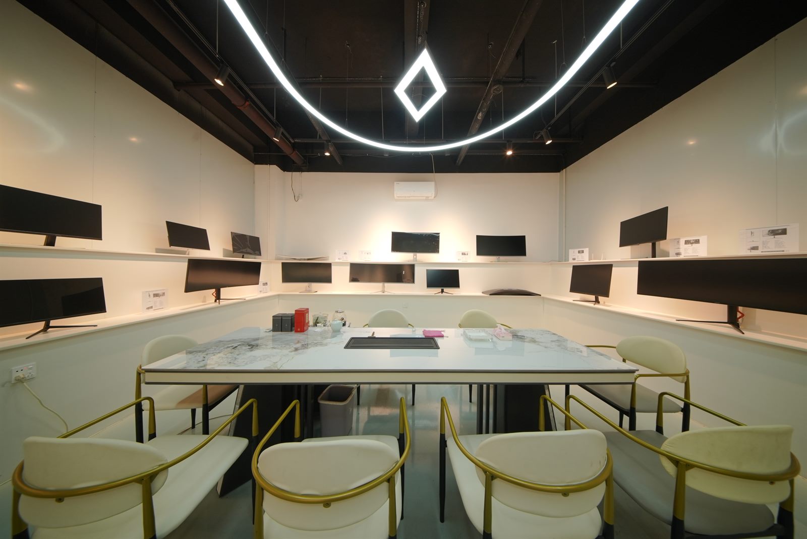 Monitor showroom with multiple display samples on the walls